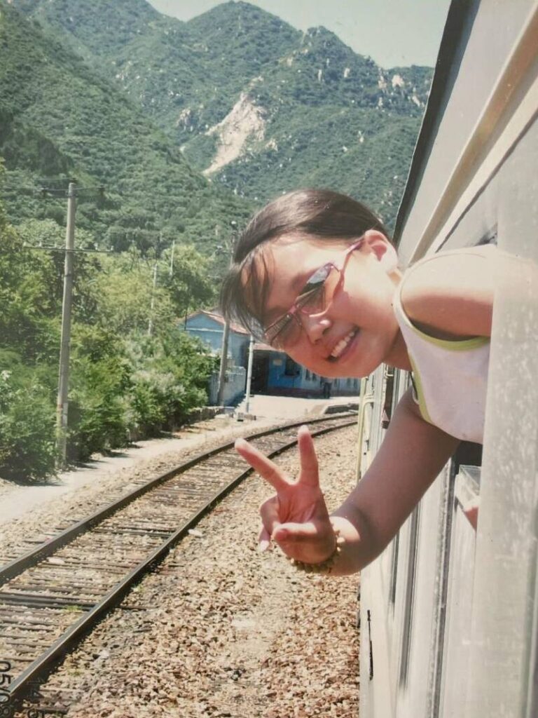 A picture of young Nomin travelling in the train