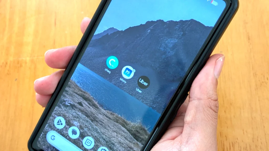 smartphone screen with 3 applications, cheq, mony and uber